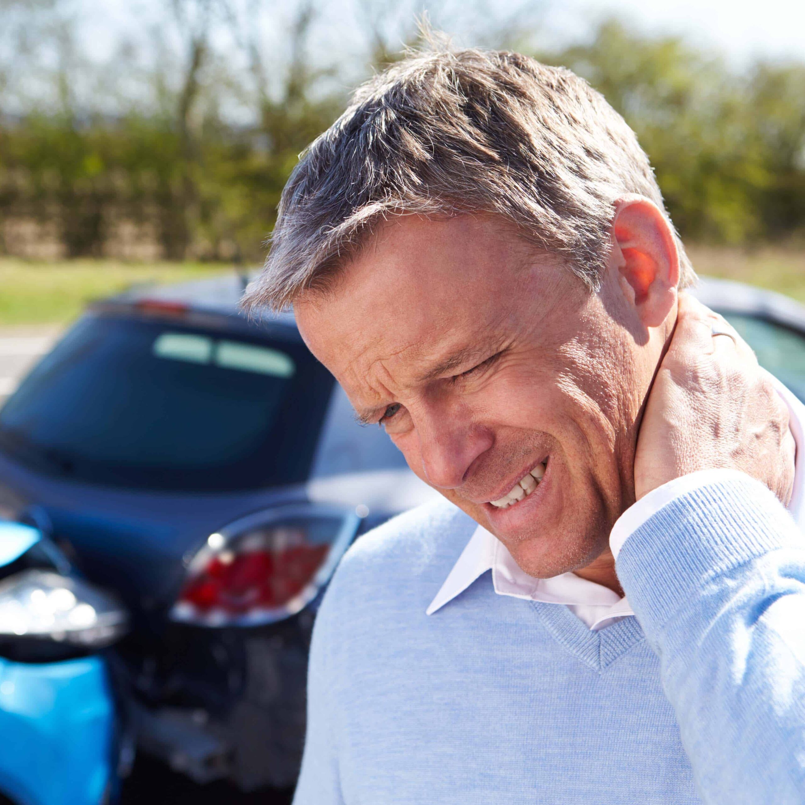 Driver Suffering From Whiplash After Traffic Collision