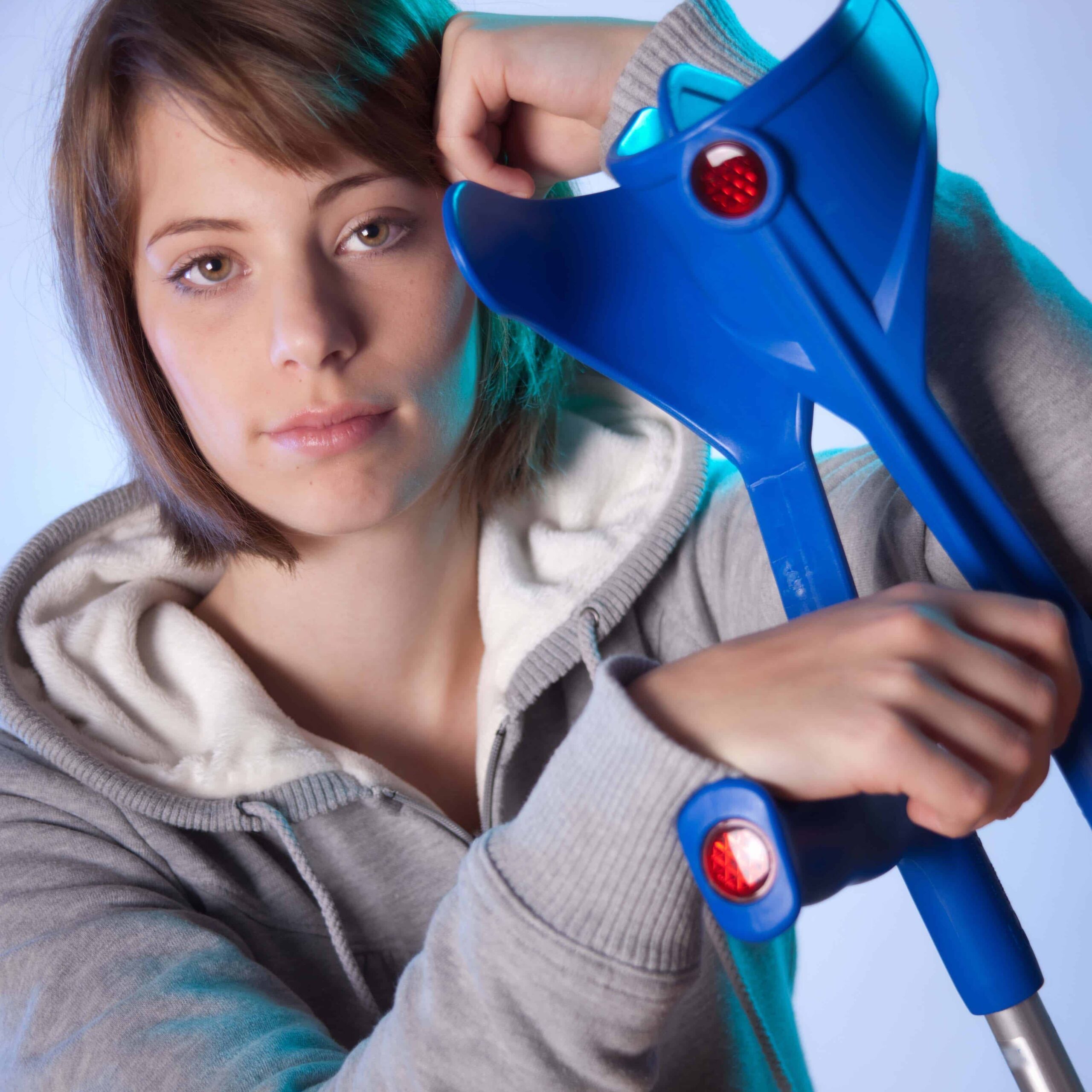 Woman leaning against crutches