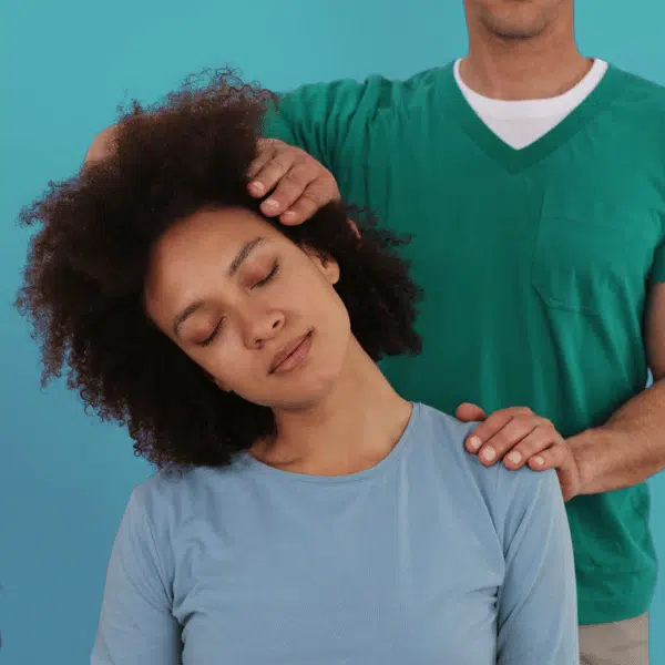 Chiropractor performing spinal adjustment on patient using evidence-based technique